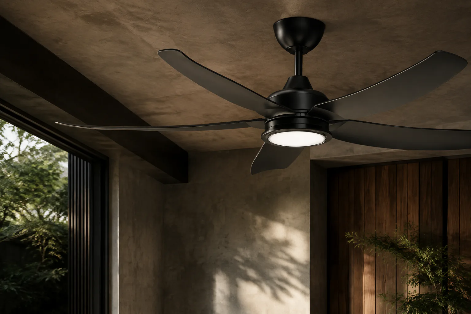 Close-up of a black five-blade ceiling fan in a contemporary interior